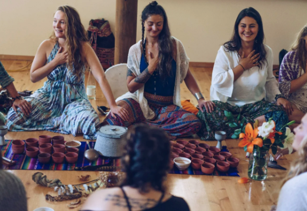 Group of women in a cacao and sound healing circle at StarryPines